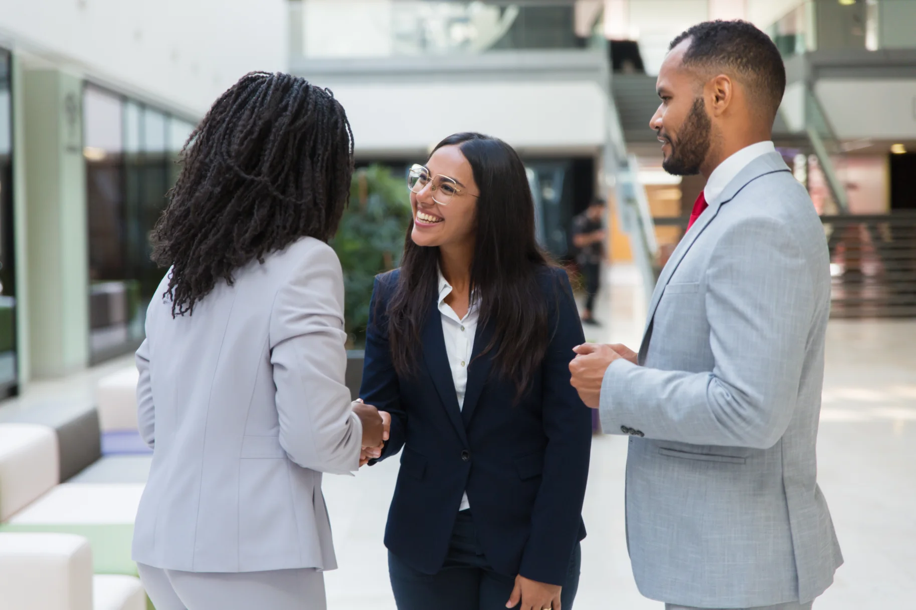female-diverse-business-partners-shaking-hands